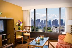 a hotel room with a view of a city at Courtyard by Marriott Boston Logan Airport in Boston