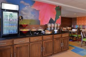 a restaurant with a counter with a drink machine at Fairfield Inn and Suites by Marriott Dayton Troy in Troy