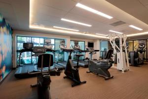a gym with treadmills and ellipticals in a building at Greensboro-High Point Marriott Airport in Greensboro