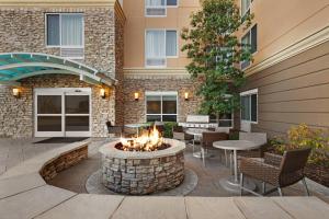 a courtyard with a fire pit in front of a building at TownePlace Suites by Marriott Chattanooga Near Hamilton Place in Chattanooga