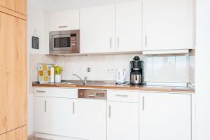 Kuchyň nebo kuchyňský kout v ubytování Haus Hanseatic, Wohnung 603