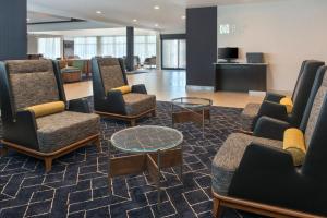 a waiting area with chairs and a table in a lobby at Courtyard by Marriott Annapolis in Annapolis