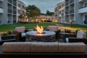 a fire pit in the courtyard of a building at Courtyard by Marriott Annapolis in Annapolis