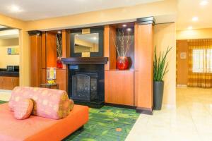 a living room with a couch and a fireplace at Fairfield Inn & Suites Billings in Billings