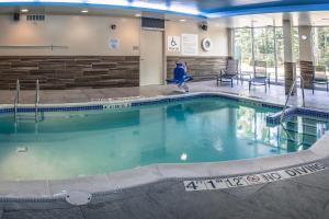 a large swimming pool in a hotel lobby at Fairfield Inn & Suites by Marriott Wisconsin Dells in Wisconsin Dells