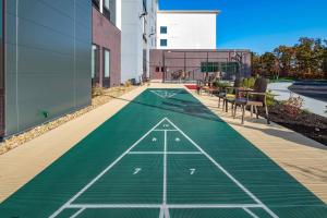 an artificial tennis court on the side of a building at SpringHill Suites By Marriott Wrentham Plainville in Wrentham