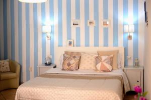 A bed or beds in a room at Superior Apartment le Case del Sole Licata