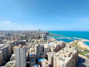 an aerial view of a city and the ocean at San Stefano Grand Plaza in Alexandria