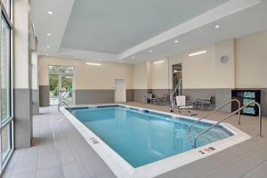 a large swimming pool in a building at TownePlace Suites by Marriott Columbus Dublin in Dublin