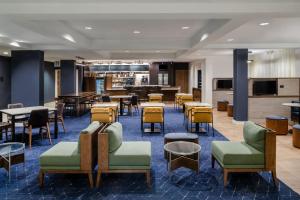 a lobby with tables and chairs and a cafeteria at Courtyard by Marriott Denver Golden/Red Rocks in Golden