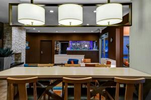 a large dining room with a large table and chairs at Fairfield Inn by Marriott Dothan in Dothan