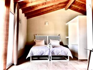Postel nebo postele na pokoji v ubytování Mythos apts rentit