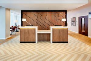 a lobby with a reception desk with a wall at Residence Inn by Marriott Aberdeen in Aberdeen