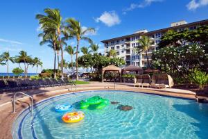 a swimming pool with two inflatable boats in it at The Westin Ka'anapali Ocean Resort Villas North in Lahaina