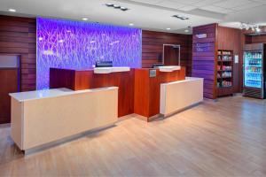 a lobby with a purple wall in a store at Fairfield Inn & Suites by Marriott Hollister in Hollister