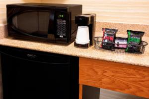 a microwave sitting on top of a kitchen counter at Fairfield Inn & Suites Merrillville in Merrillville