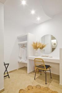a dressing room with a chair and a mirror at Diana Art Boutique Hotel in Rhodes Town