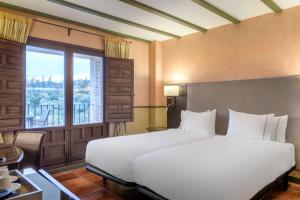 Postel nebo postele na pokoji v ubytování AC Hotel Ciudad de Toledo by Marriott