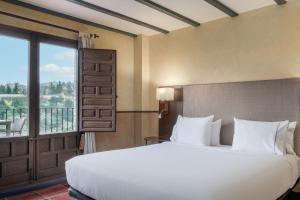 Postel nebo postele na pokoji v ubytování AC Hotel Ciudad de Toledo by Marriott