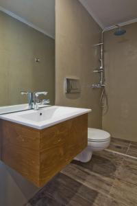 a bathroom with a sink and a toilet at Diana Art Boutique Hotel in Rhodes Town