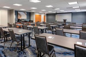 an empty classroom with tables and chairs in a room at Fairfield Inn & Suites by Marriott Matthews Charlotte in Charlotte