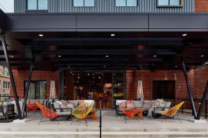 a group of chairs and tables on a patio at Moxy Chattanooga Downtown in Chattanooga