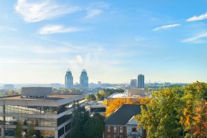 a view of a city with buildings and trees at Aloft Atlanta Perimeter Center in Sandy Springs