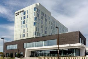 a building with a sign on the side of it at Courtyard by Marriott Quebec City in Quebec City