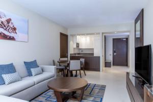 a living room with a couch and a table at Residence Inn by Marriott Algiers Bab Ezzouar in Alger