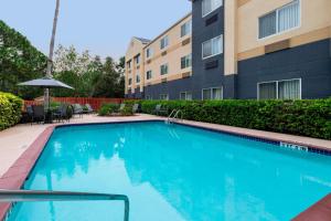 a swimming pool in front of a building at Fairfield Inn and Suites St Petersburg Clearwater in Clearwater
