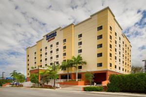 a hotel building with a sign on the side of it at Fairfield Inn & Suites by Marriott Miami Airport South in Miami