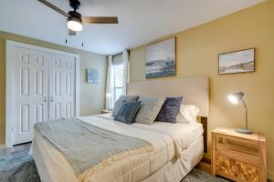 een slaapkamer met een bed en een witte deur bij Kerrville Vacation Rental Across From River Trail! in Kerrville