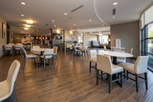 a dining room with tables and chairs in a restaurant at Residence Inn Nashville Mt. Juliet in Mount Juliet