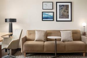 a living room with a couch and a table at Residence Inn Houston Northwest / Willowbrook in Houston
