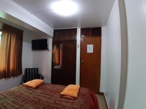Postel nebo postele na pokoji v ubytování Hatun Quilla