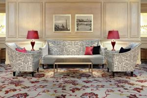 a living room with a couch and two chairs at The Westin Paris - Vendôme in Paris