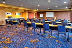 a conference room with tables and chairs in it at Courtyard by Marriott San Marcos in San Marcos