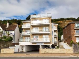 a large apartment building with a lot of windows at Lower Chine Apartment in Shanklin
