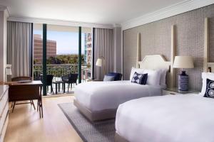 a hotel room with two beds and a balcony at The Ritz-Carlton Coconut Grove, Miami in Miami