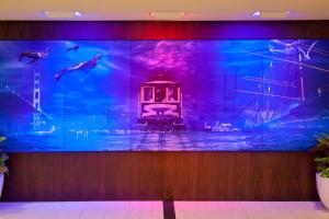 a large wall with a picture of an aquarium at San Francisco Marriott Fisherman's Wharf in San Francisco
