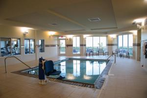 a large swimming pool in a hotel lobby at Courtyard by Marriott Morgantown in Morgantown