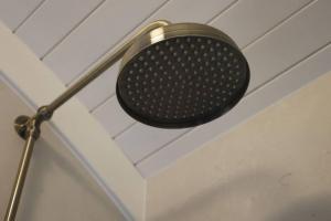 a shower head hanging from a ceiling at The Winford Retreat in Winford