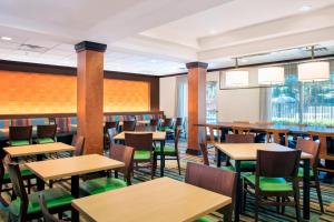 an empty dining room with tables and chairs at Fairfield Inn and Suites by Marriott Lakeland Plant City in Plant City