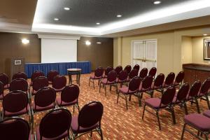 a room with rows of chairs and a podium at Courtyard Harrisonburg in Harrisonburg