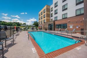 a swimming pool in front of a building at Fairfield Inn & Suites by Marriott Chickasha in Chickasha