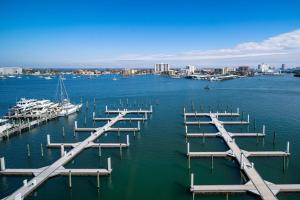 a group of docks in the water with boats at Courtyard by Marriott Clearwater Beach in Clearwater Beach