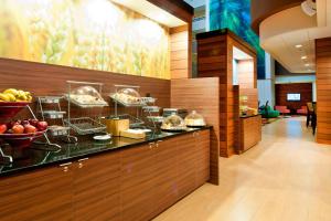 a buffet line with food on display in a restaurant at Fairfield Inn and Suites by Marriott Durham Southpoint in Durham