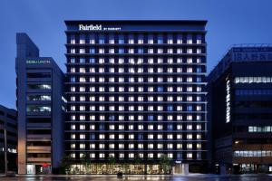 a tall building with a hotel sign on it at Fairfield by Marriott Osaka Namba in Osaka