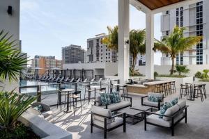 a patio with chairs and tables on a building at Element Miami Brickell in Miami