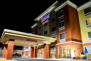 a hotel with a sign that reads miracle inn at Fairfield Inn & Suites by Marriott Stafford Quantico in Stafford